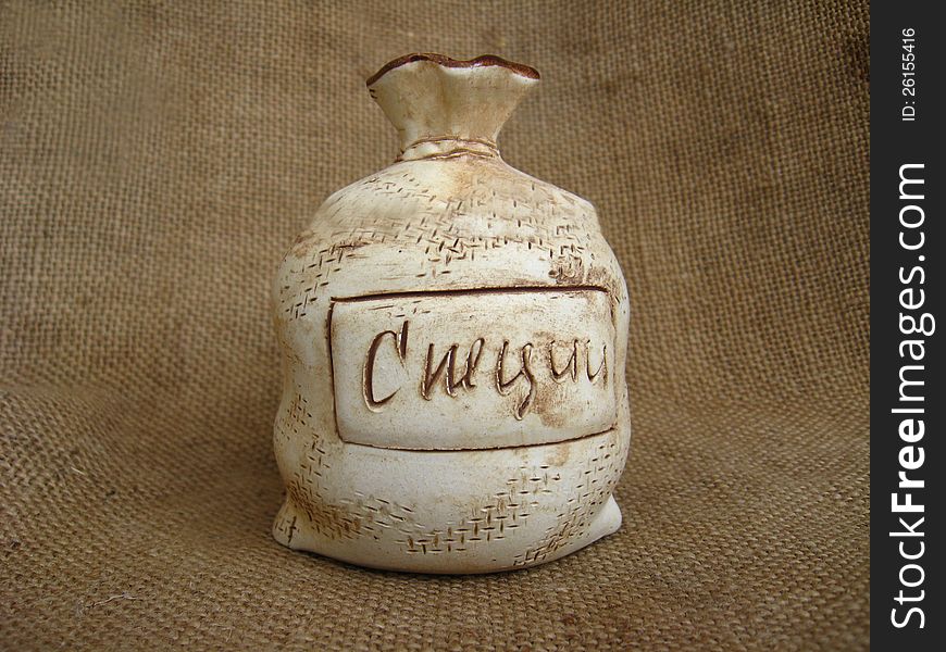 Ceramic Bag On A Brown Background