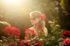Young Woman In Flower Garden Smelling Red Roses 1 Stock Photo Young Woman In Flower Garden Smelling Red Roses 1 Stock Photo