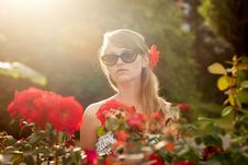 Young Woman In Flower Garden Smelling Red Roses 3 Royalty Free Stock Photography Young Woman In Flower Garden Smelling Red Roses 3 Royalty Free Stock Photography