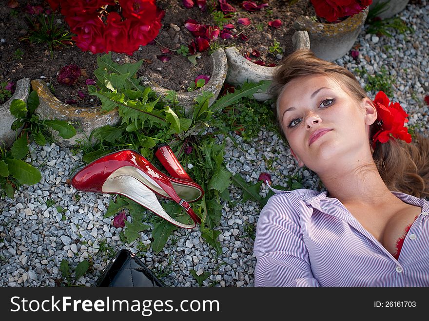 Sexy young woman lying on the ground