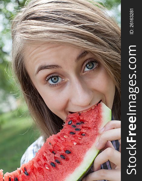 Young woman with watermelon outdoors. Young woman with watermelon outdoors