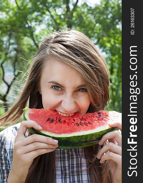 Young woman with watermelon outdoors. Young woman with watermelon outdoors