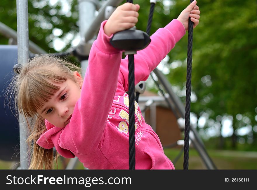 Young girl have fun on outdoor playground. Young girl have fun on outdoor playground