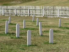 Old Cemetery White Headstones In A Field. Stock Image