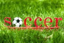 Inscription Soccer On The Green Grass Royalty Free Stock Images