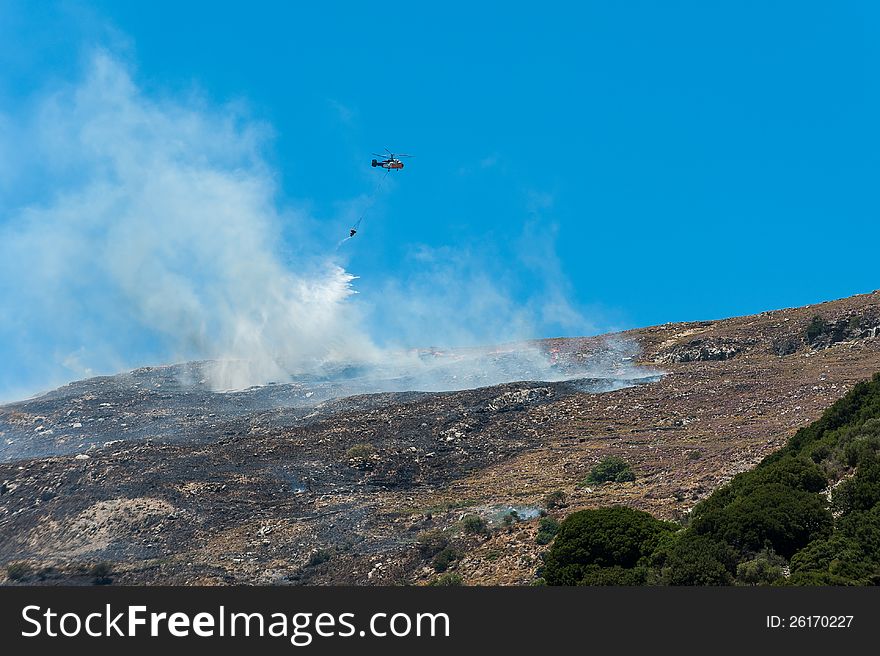 Helicopter fighting a Bushfire in the Mountains of Crete/Greece