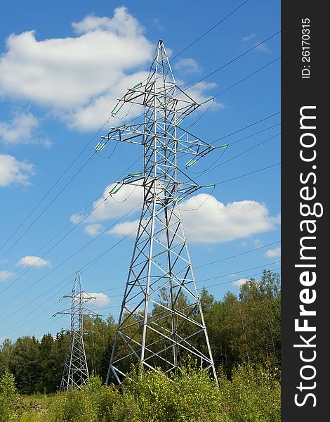 Supports power lines on a summer day in the sky