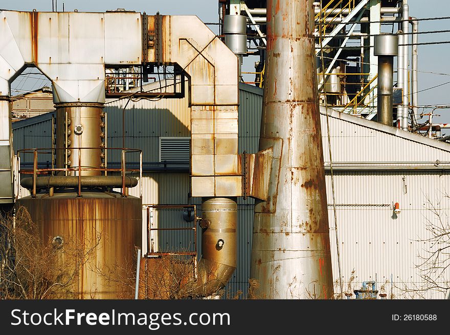 Rusty pipes of old heavy industrial factory facilities. Rusty pipes of old heavy industrial factory facilities