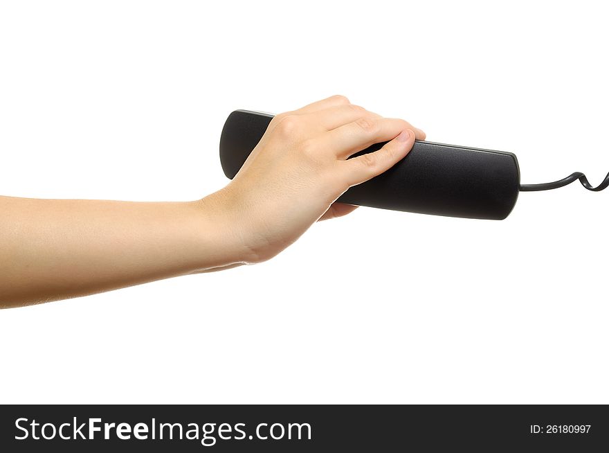 Hand holding black phone receiver isolated on white background. Hand holding black phone receiver isolated on white background