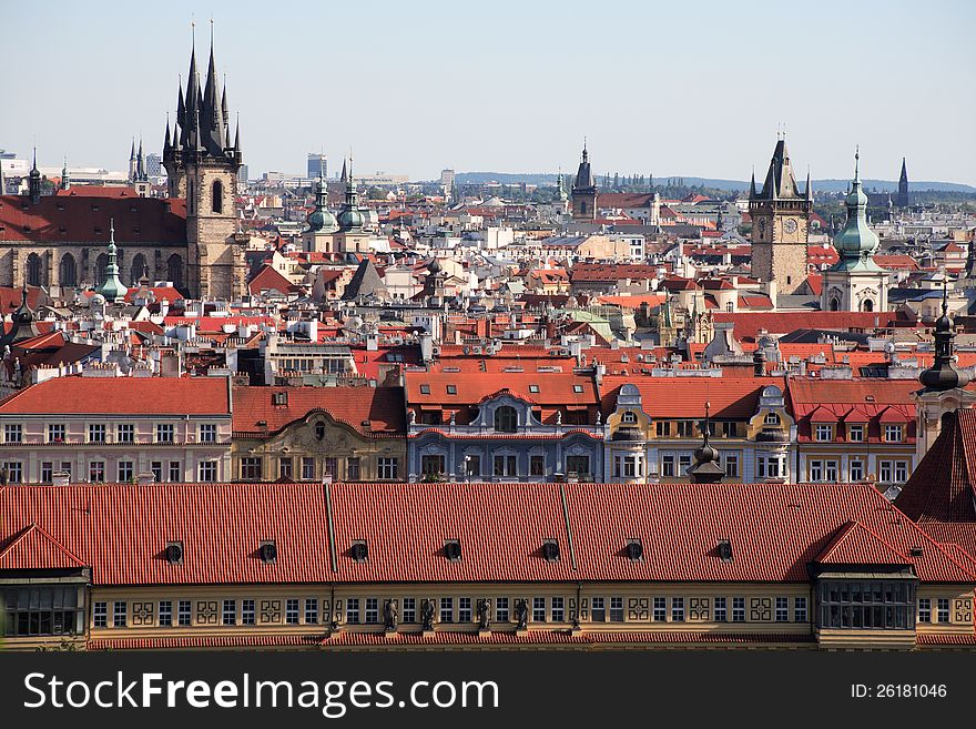 View of red tile roofs and high gothic towers in Prague, Czech Republic. View of red tile roofs and high gothic towers in Prague, Czech Republic