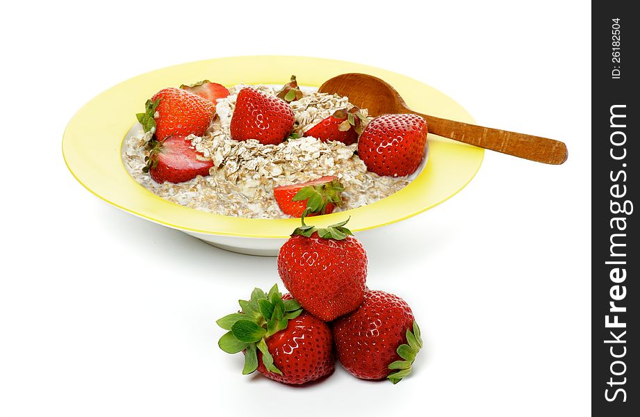 Healthy Muesli, Milk and Fresh Strawberry on Yellow plate with Wooden Spoon isolated on white background. Healthy Muesli, Milk and Fresh Strawberry on Yellow plate with Wooden Spoon isolated on white background