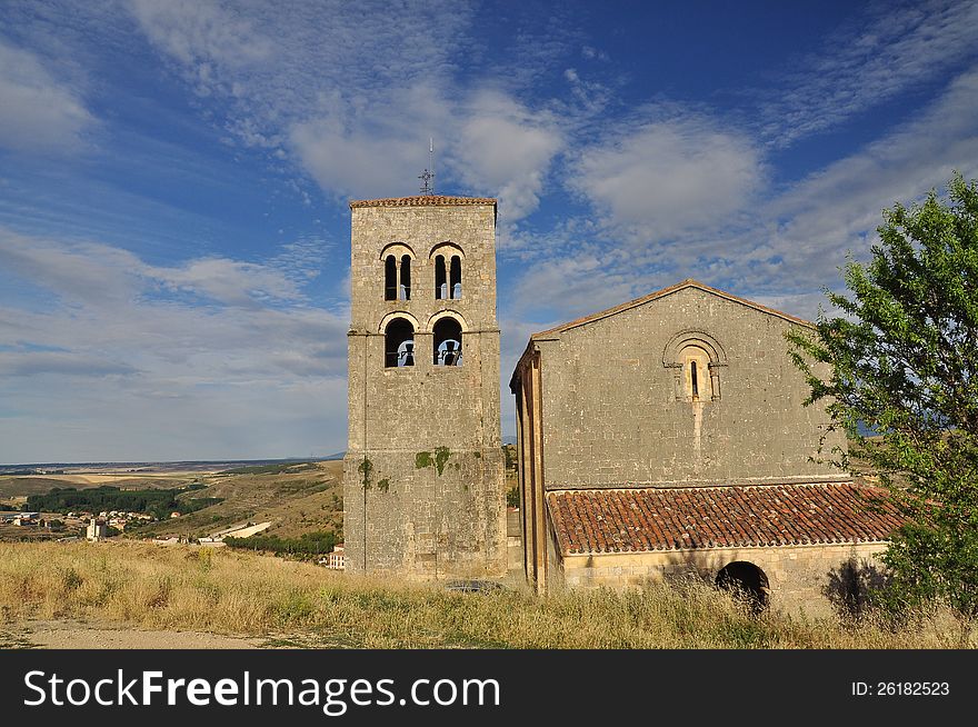 Village of Sepulveda and hilly countryside. Main medieval church and bell tower. Province of Segovia, Castile region, Spain. Village of Sepulveda and hilly countryside. Main medieval church and bell tower. Province of Segovia, Castile region, Spain