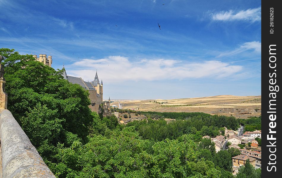 The fairytale alcazar castle of Segovia. View of the surrounding countryside. Castile region, Spain. The fairytale alcazar castle of Segovia. View of the surrounding countryside. Castile region, Spain