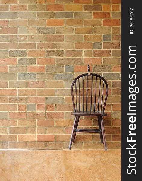 Red brick wall and chair on the wall