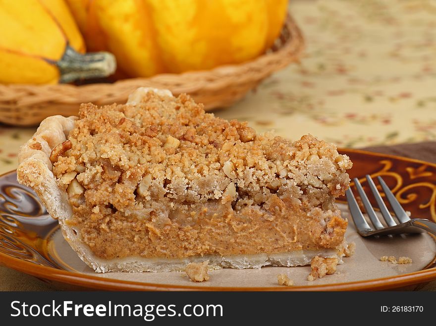 Closeup of a slice of streusel pumpkin pie. Closeup of a slice of streusel pumpkin pie