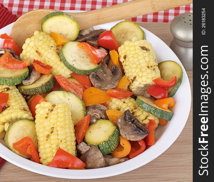 Baked peppers, zucchini, mushrooms and corn in a bowl. Baked peppers, zucchini, mushrooms and corn in a bowl