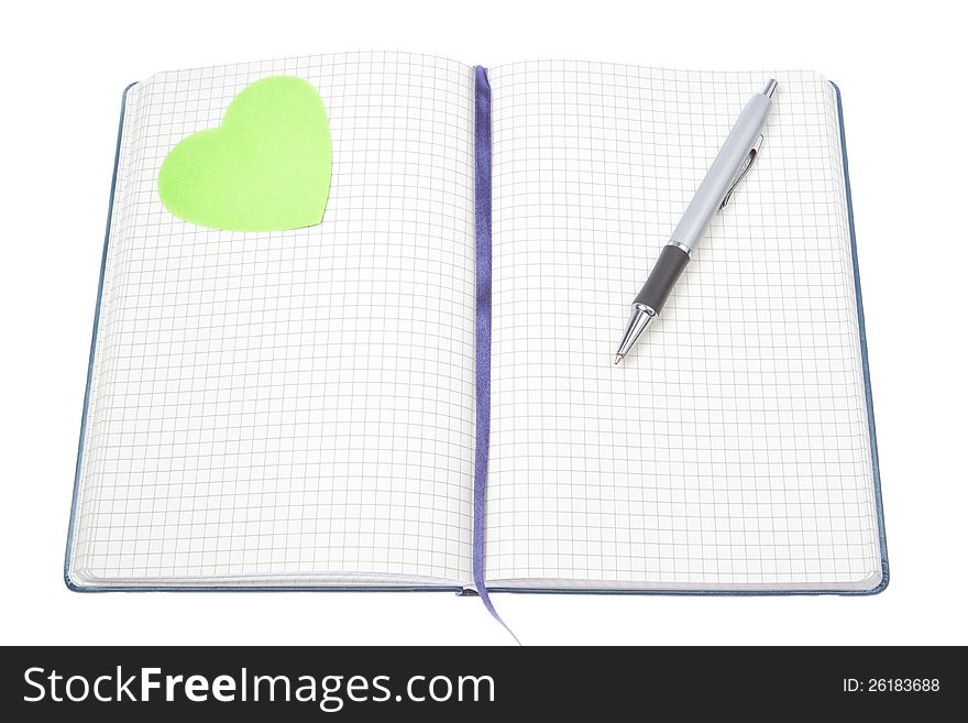 Open notepad with a pen and a green heart.