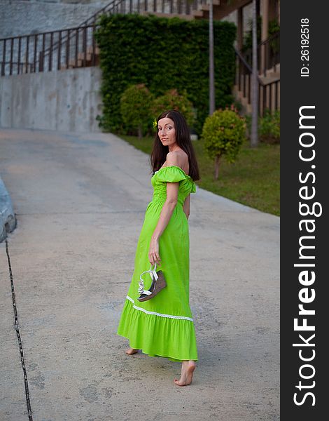 Girl walking barefoot on the site