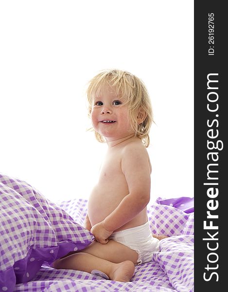 Little boy in bed isolated on white