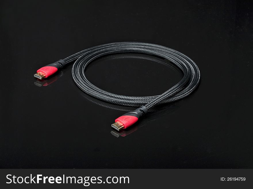HDMI and Scart cables on black background