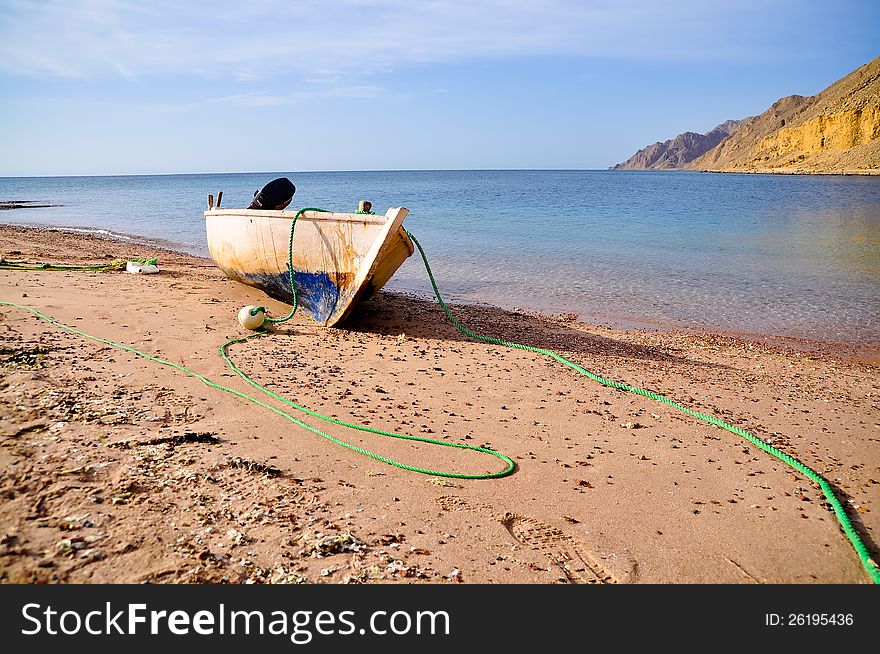 Old fisherman boat at the beach. Panorama. Old fisherman boat at the beach. Panorama