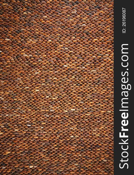 Pebbles stone wall brown texture. Pebbles stone wall brown texture