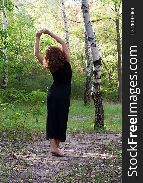 Girl is pulling the birch forest. Girl is pulling the birch forest