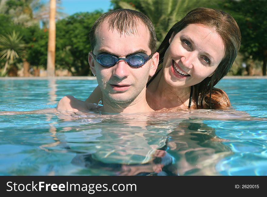 Man and woman in a swiming pool. Man and woman in a swiming pool