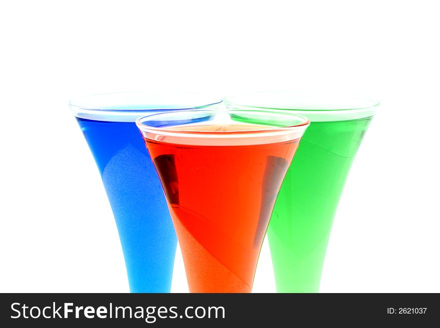 Close up at stylish glasses with coloured drinks. Close up at stylish glasses with coloured drinks