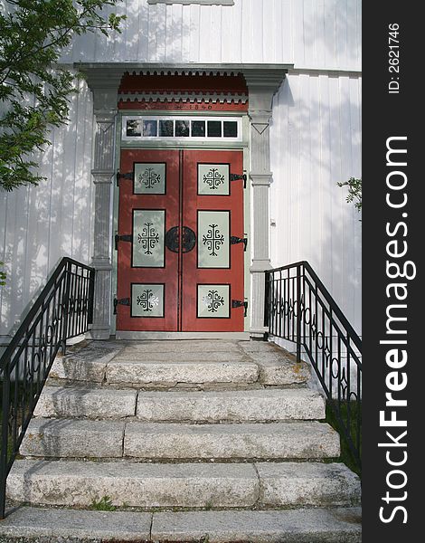Stairs and door of a white Norwegian church. Stairs and door of a white Norwegian church