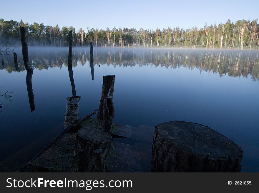 Lake with fog over it at sunrise. Lake with fog over it at sunrise