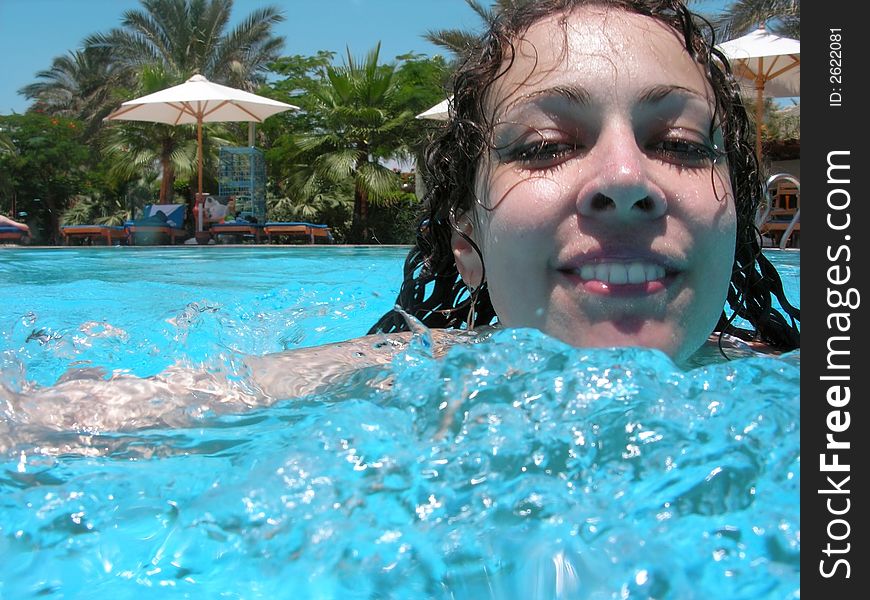 Girl swiming in the pool