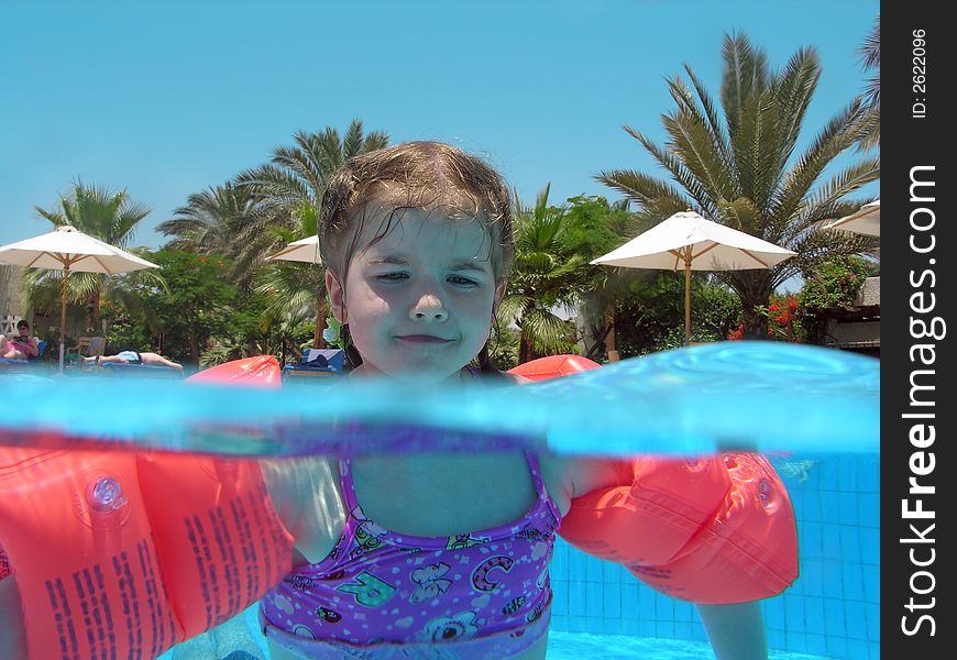 Little girl in a swimming pool. Little girl in a swimming pool