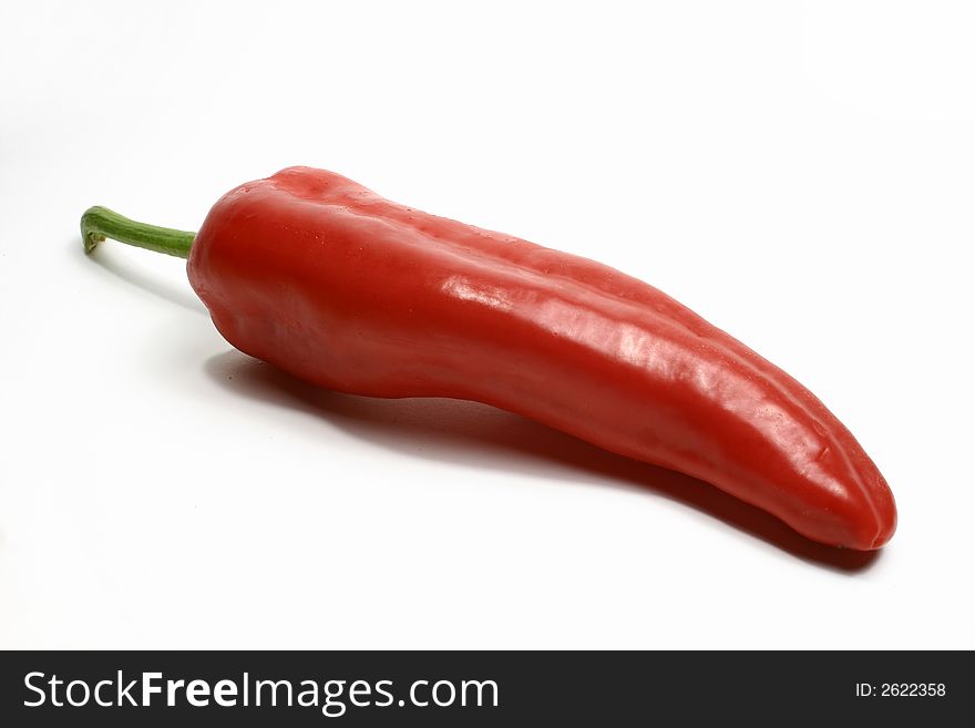 A red pepper isolated on a white background.