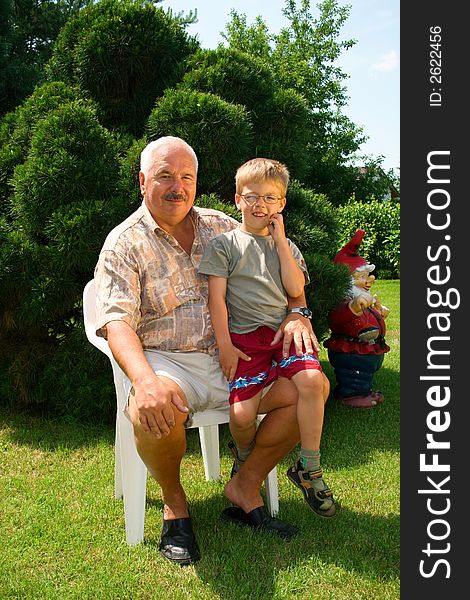 Grandfather and grandson spend time together in the park.