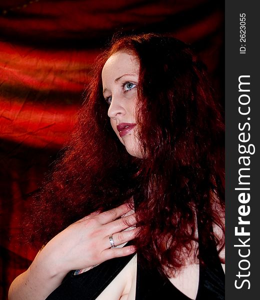 Woman with long red hair posing. Woman with long red hair posing