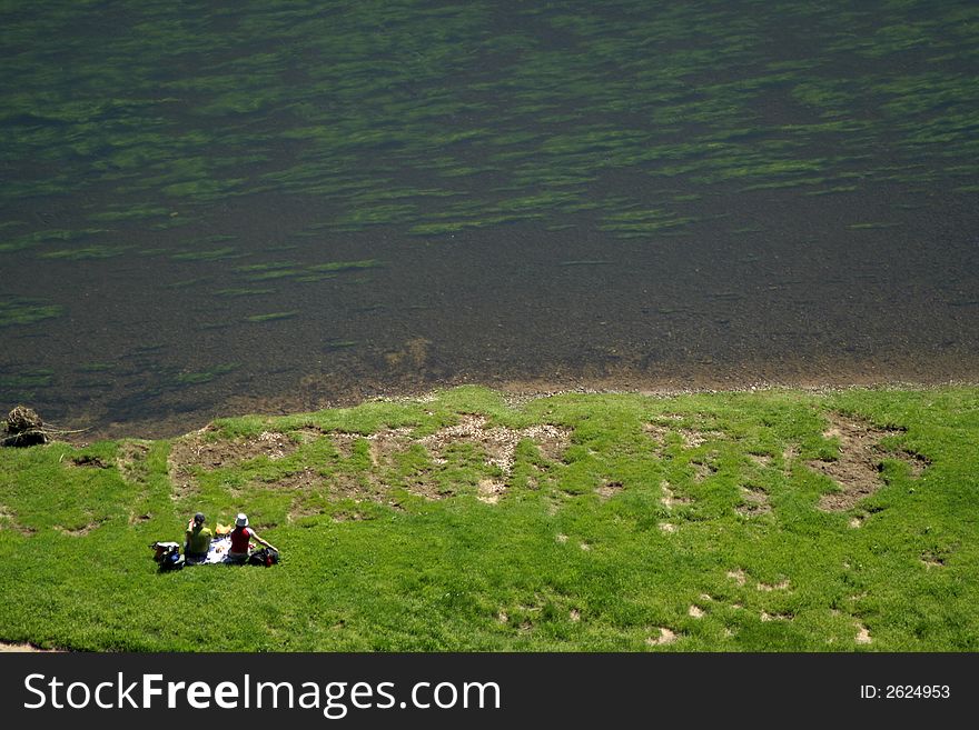 People having a picnic on gras