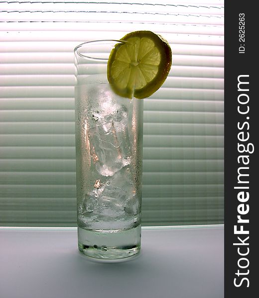 Glass with cold water and an ice