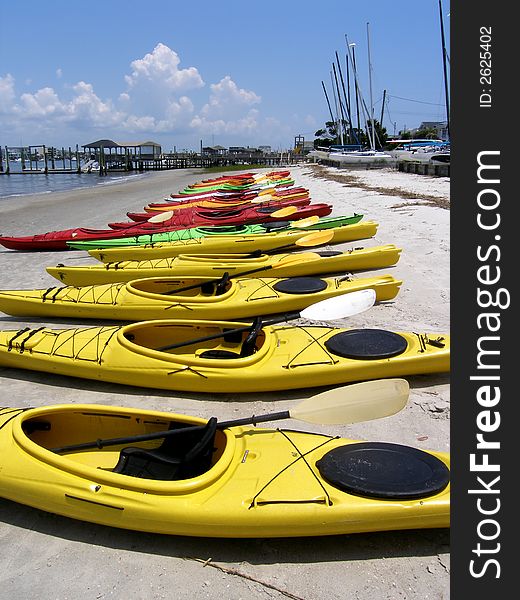 Kayaks lined up on the beach. Kayaks lined up on the beach
