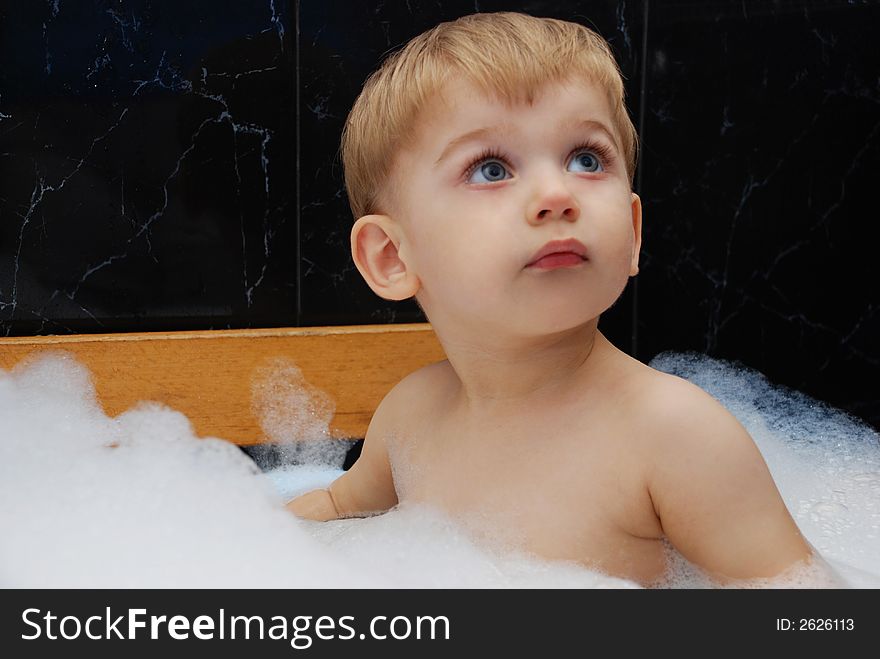 Small cute boy in the bath room