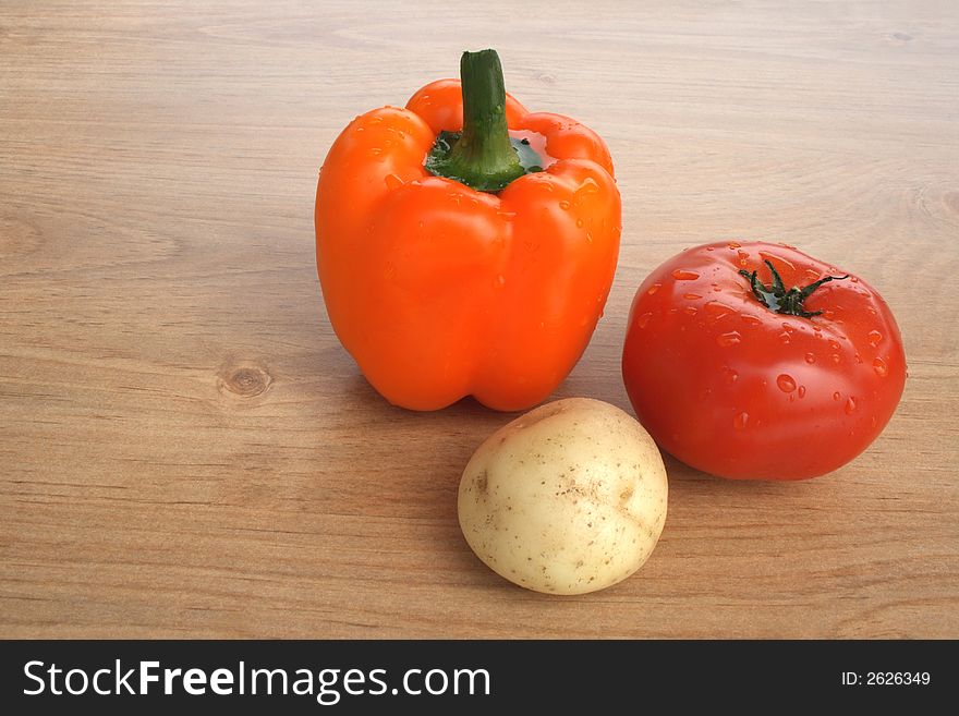 Healthy food. Sweet orange pepper, tomato and potato. Healthy food. Sweet orange pepper, tomato and potato.