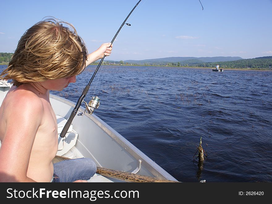 Twelve years old boy catching fish. Twelve years old boy catching fish