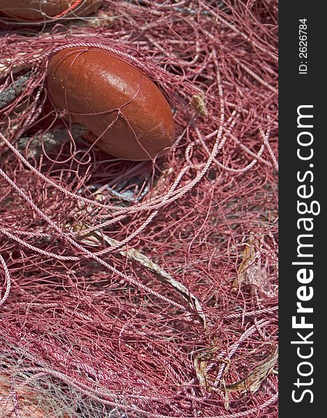 Fishing net to fish posed on the quay