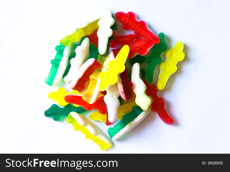 Mix of coloured crocodile candy isolated on white background. Mix of coloured crocodile candy isolated on white background