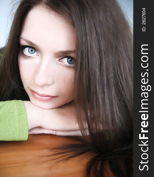 Beautiful green-eyed brunette looking straight at you. Beautiful green-eyed brunette looking straight at you