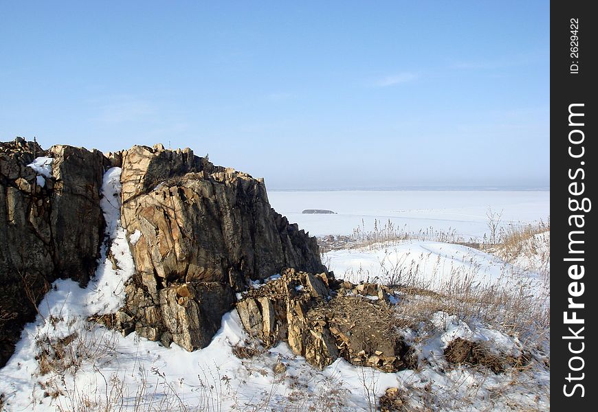 Rock in snow near fort and island Kovrizhka, Vladivostok. Rock in snow near fort and island Kovrizhka, Vladivostok