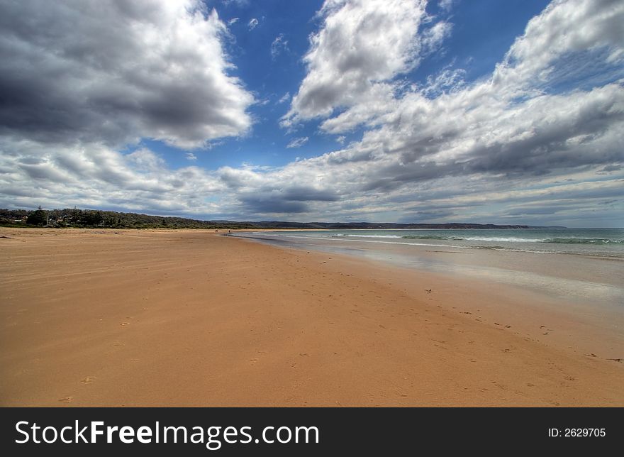 Tathra beach in Australia with blue sky and clouds