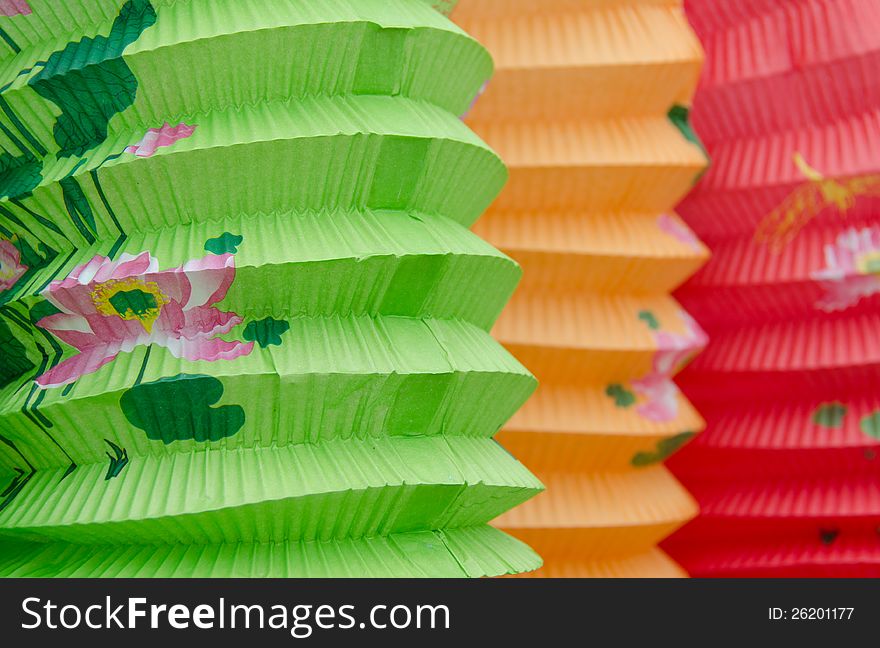 Closeup of three colorful paper Chinese lanterns