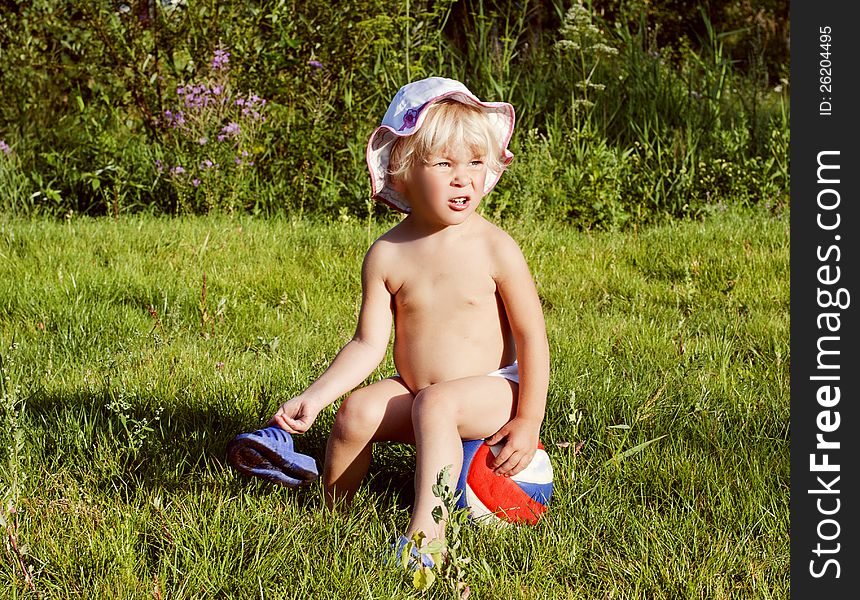 Happy little girl on the green meadow in summer. Happy little girl on the green meadow in summer