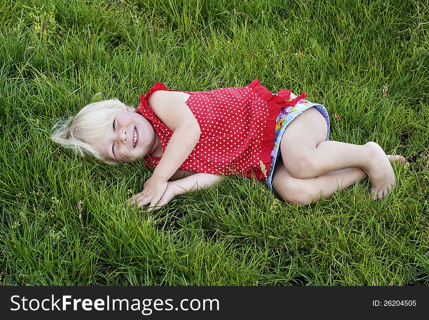 Portrait little girl on the meadow